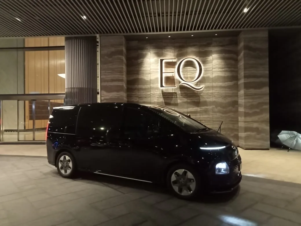 Family of four with teenagers in van transfer