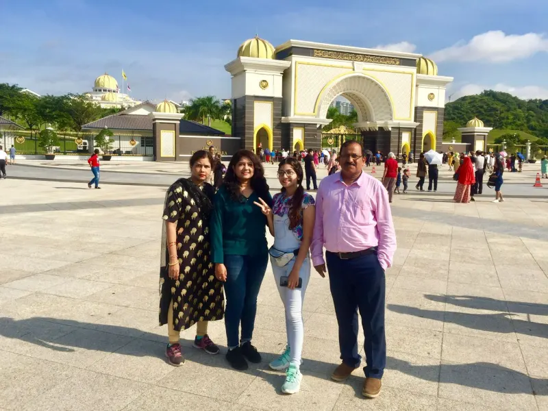 Family at Istana Negara Royal Palace gate in Kuala Lumpur