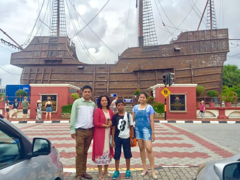 Family at Flor de la Mar Maritime Museum replica ship in Melaka