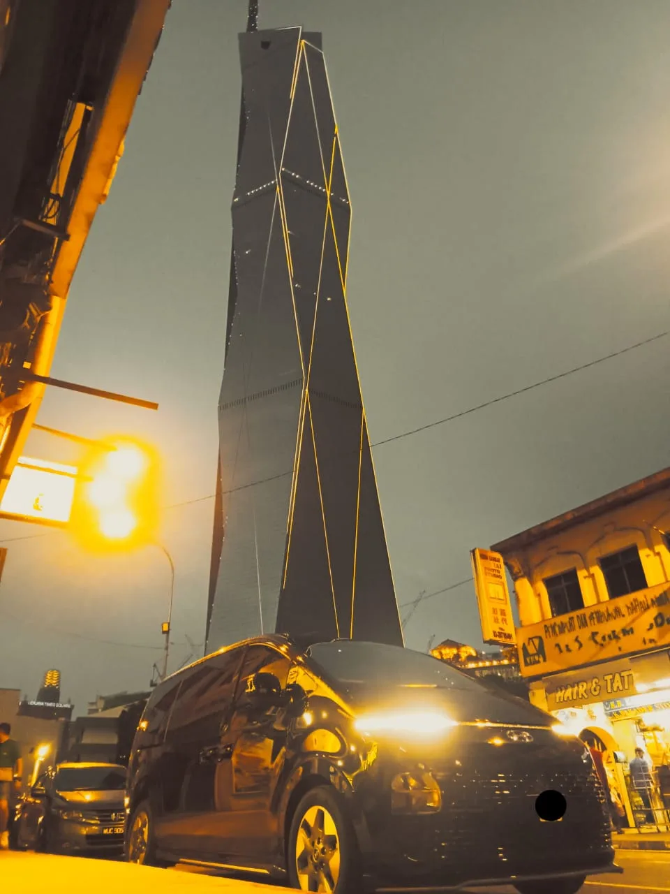 Hyundai Staria with Merdeka 118 tower illuminated at night