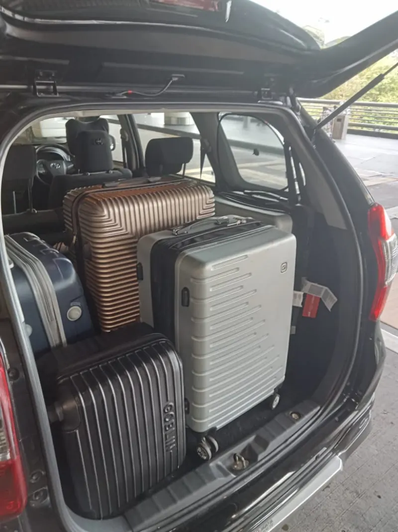 SUV boot packed with family luggage and suitcases for outstation trip