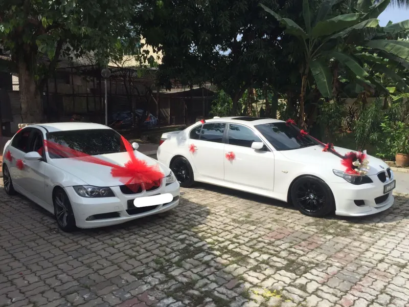 Wedding car convoy with decorated vehicles on Malaysian highway